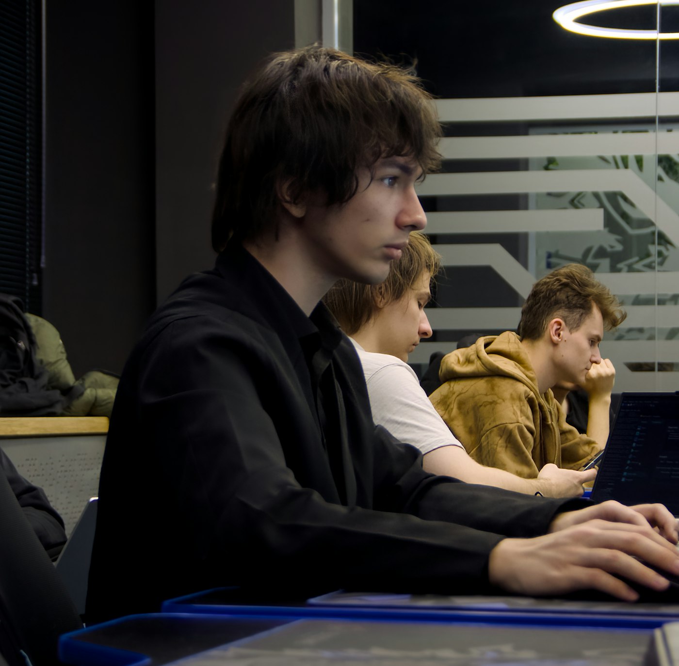 Student learning coding with laptop in a classroom